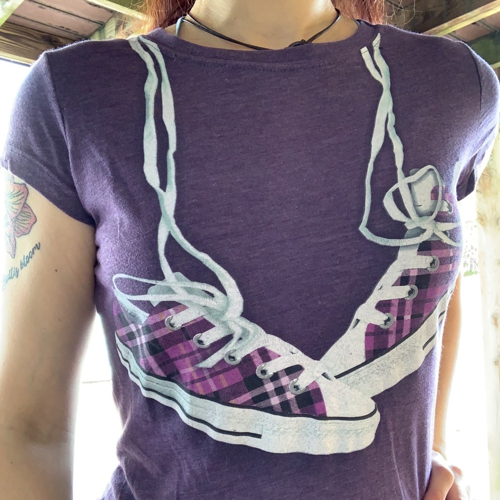 Purple Converse tshirt.